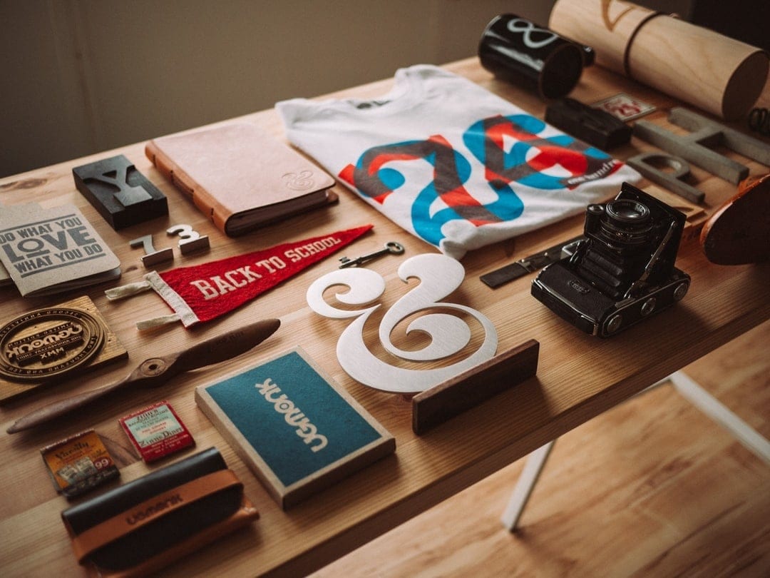 promotional materials on top of a wooden table