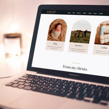 A MacBook Pro on a desk displays a webpage featuring three sections: 