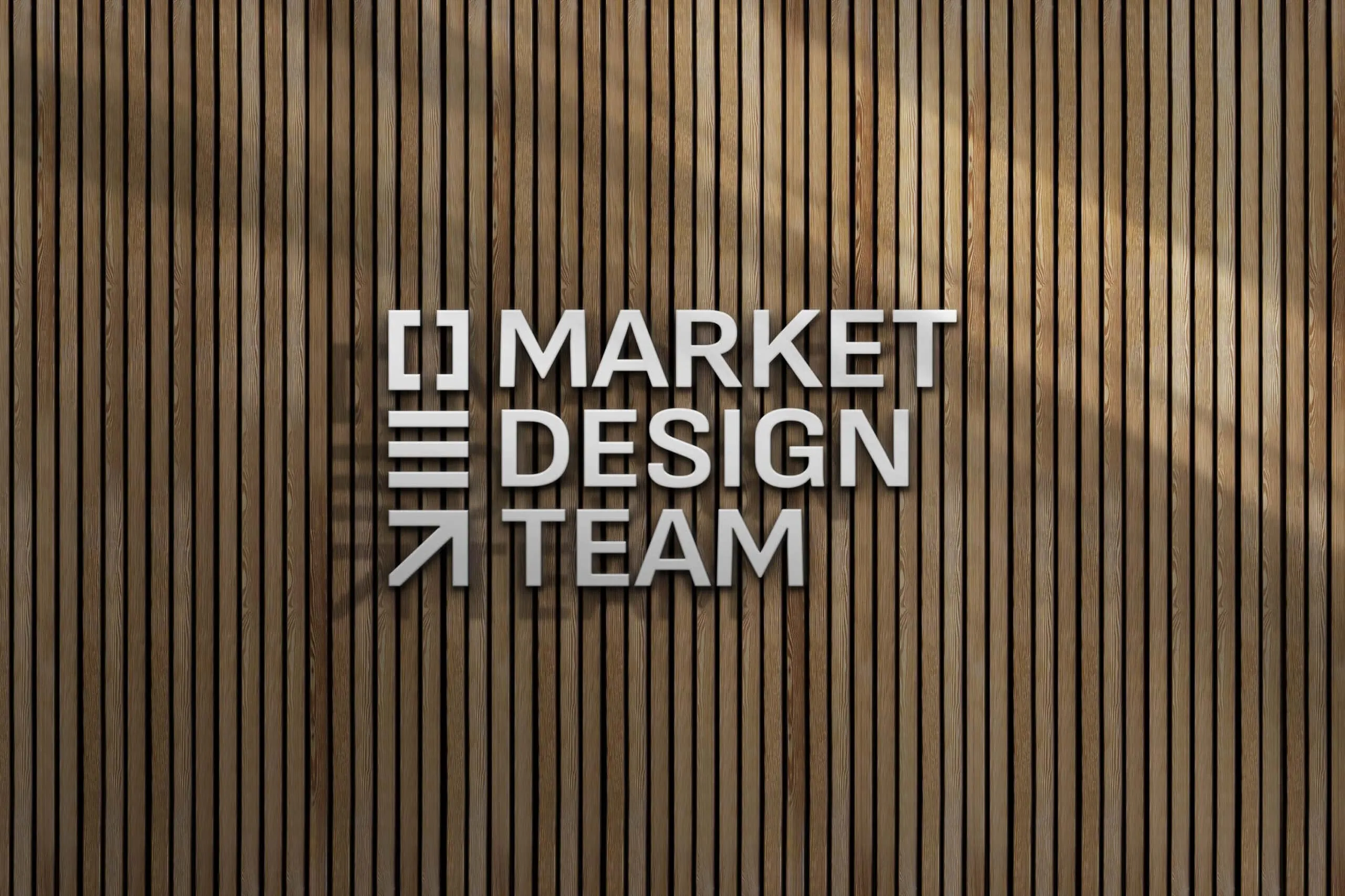 A vertical wooden plank wall serves as the background for a sign that reads 